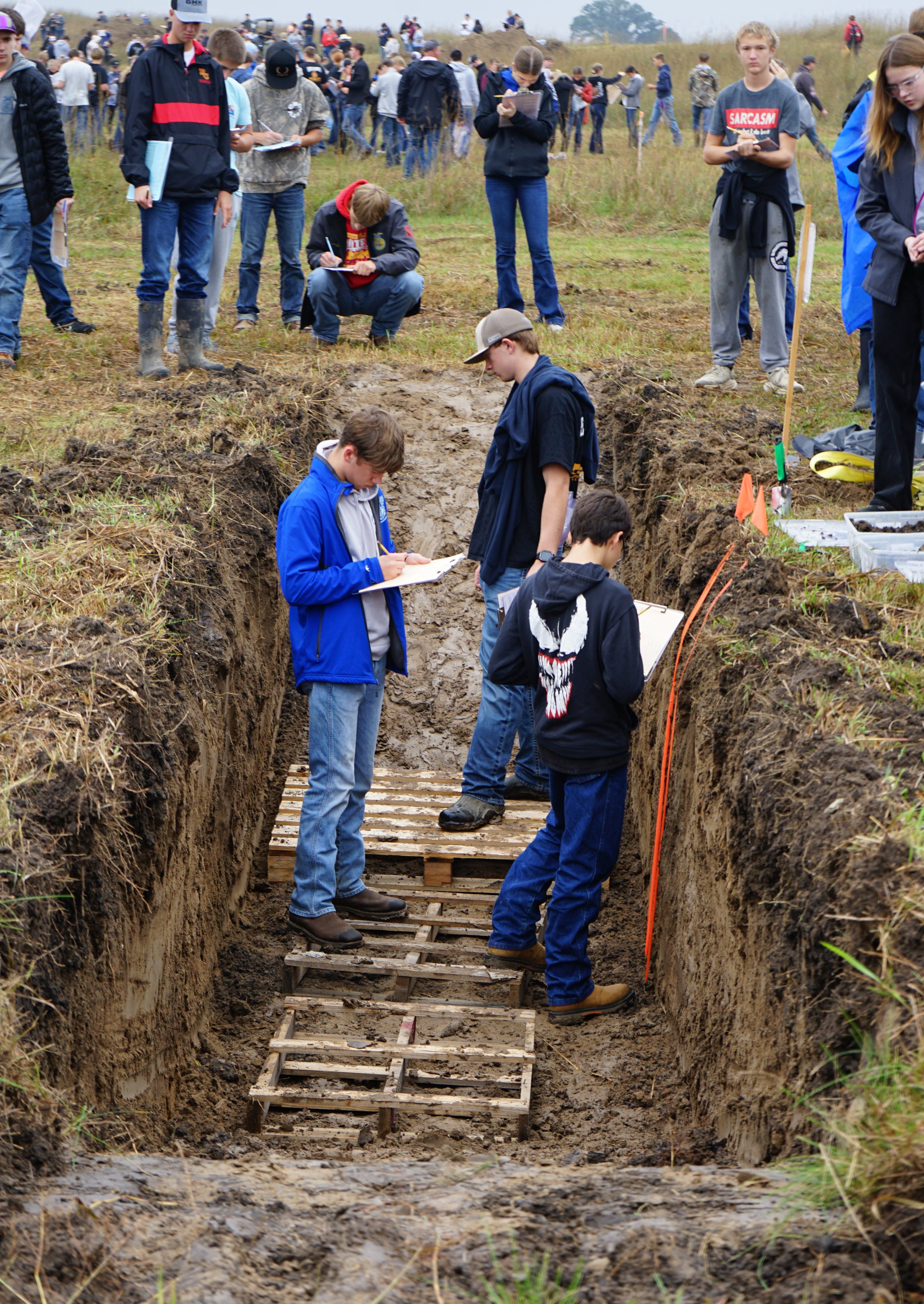 student in the soil pit during the 2026 South Central Land Judging Competition
