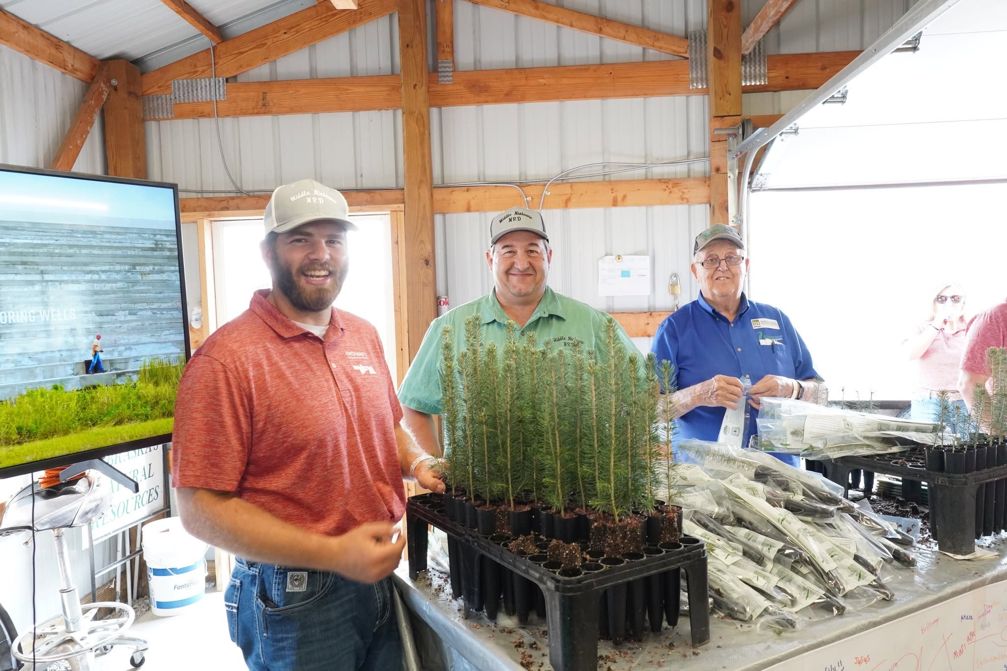 NRD employees hand out free trees at Husker Harvest Days.