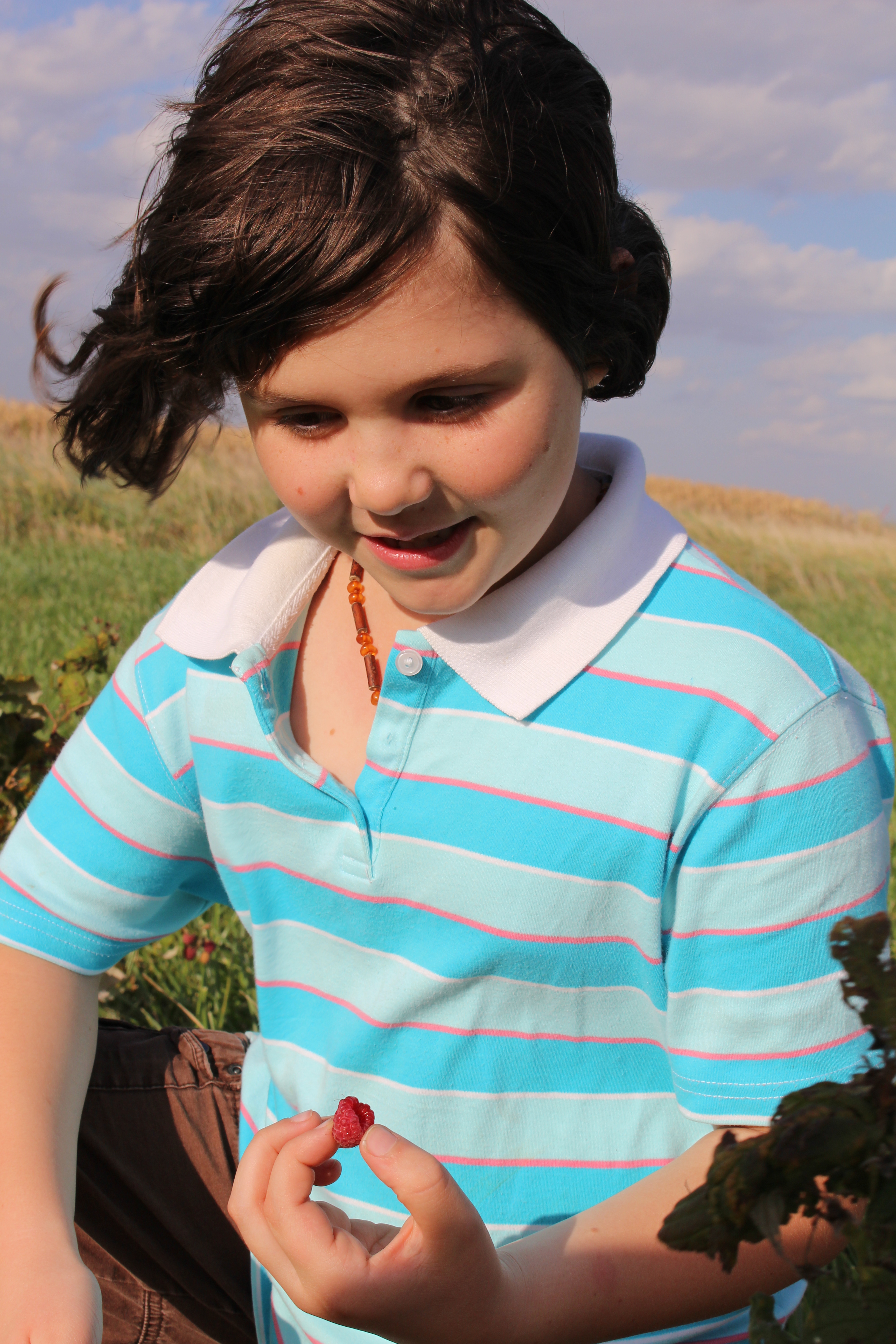 child with berry